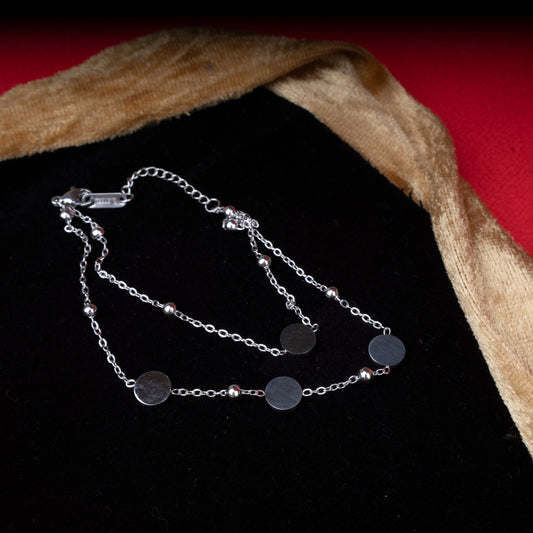 Sleek double-layer bracelet with polished disc charms and bead accents - Revaaj