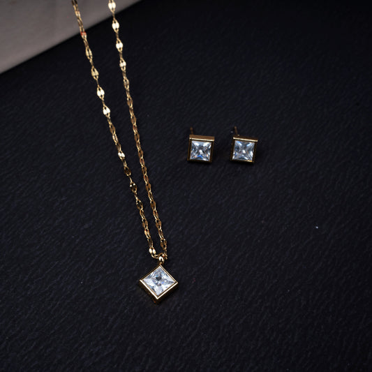 Golden square crystal necklace with matching earrings in gold-tone finish - Revaaj