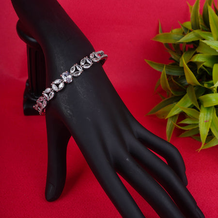 Silver bracelet with oval and round stones on black mannequin hand - Revaaj