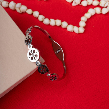 Silver designer logo cuff bracelet with crystal accents - Revaaj