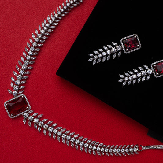 Leaf-design necklace and earrings with ruby red centerpiece and silver-tone finish - Revaaj