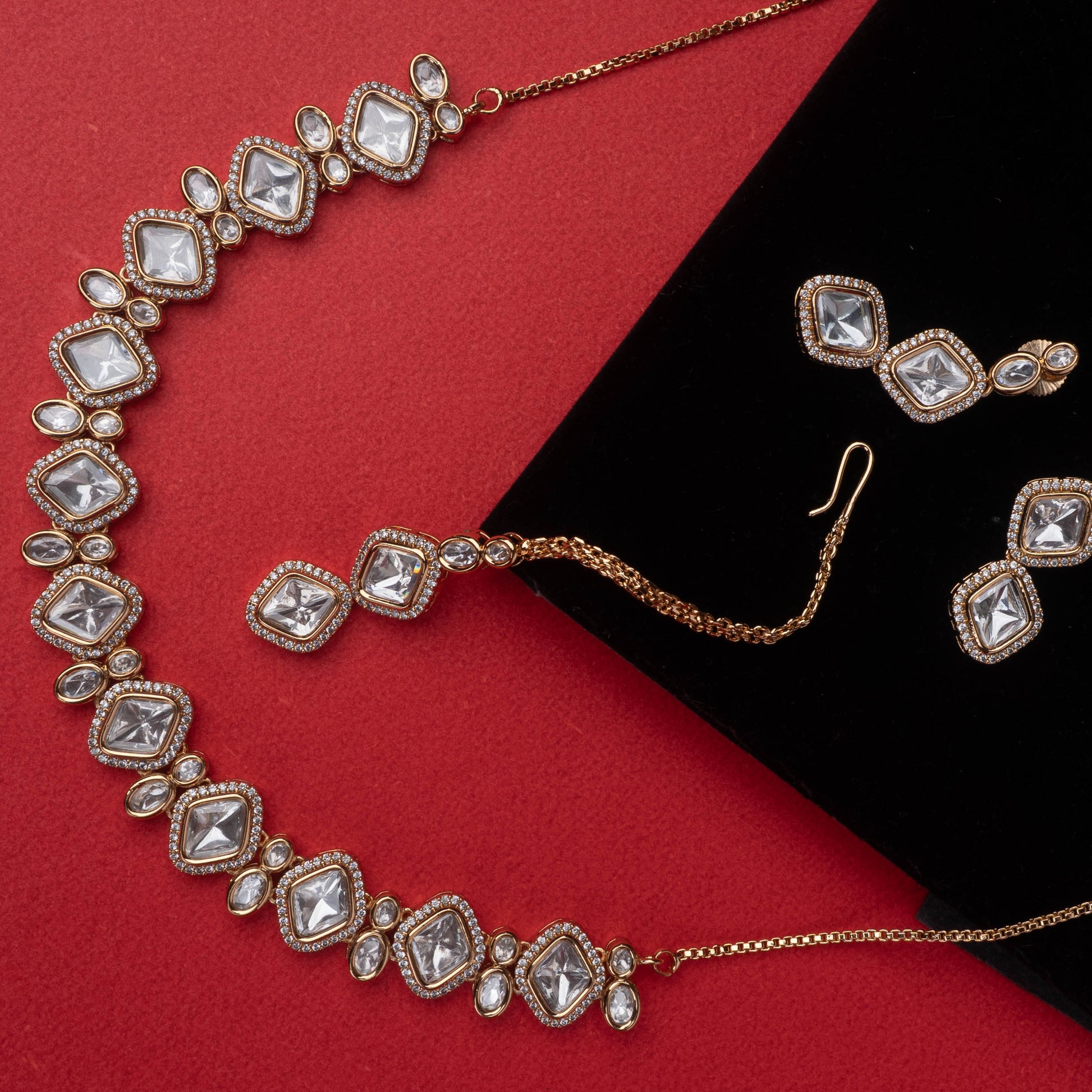 Kundan-style necklace and earrings with mirror-like stones and antique gold finish - Revaaj