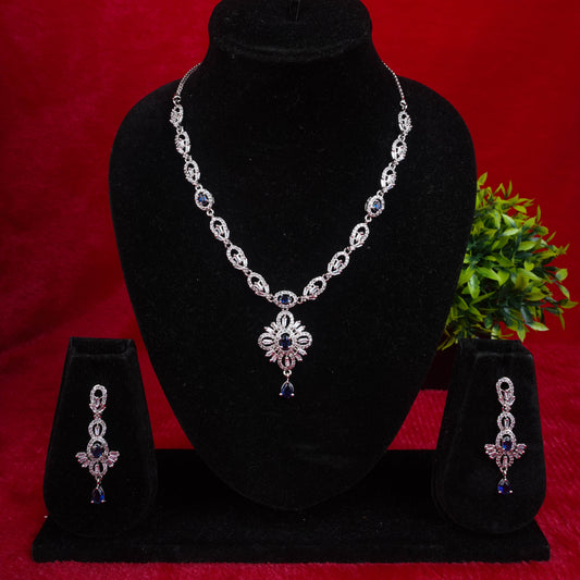 Fashion jewelry set with silver-tone finish and blue stones, including necklace and earrings - Revaaj