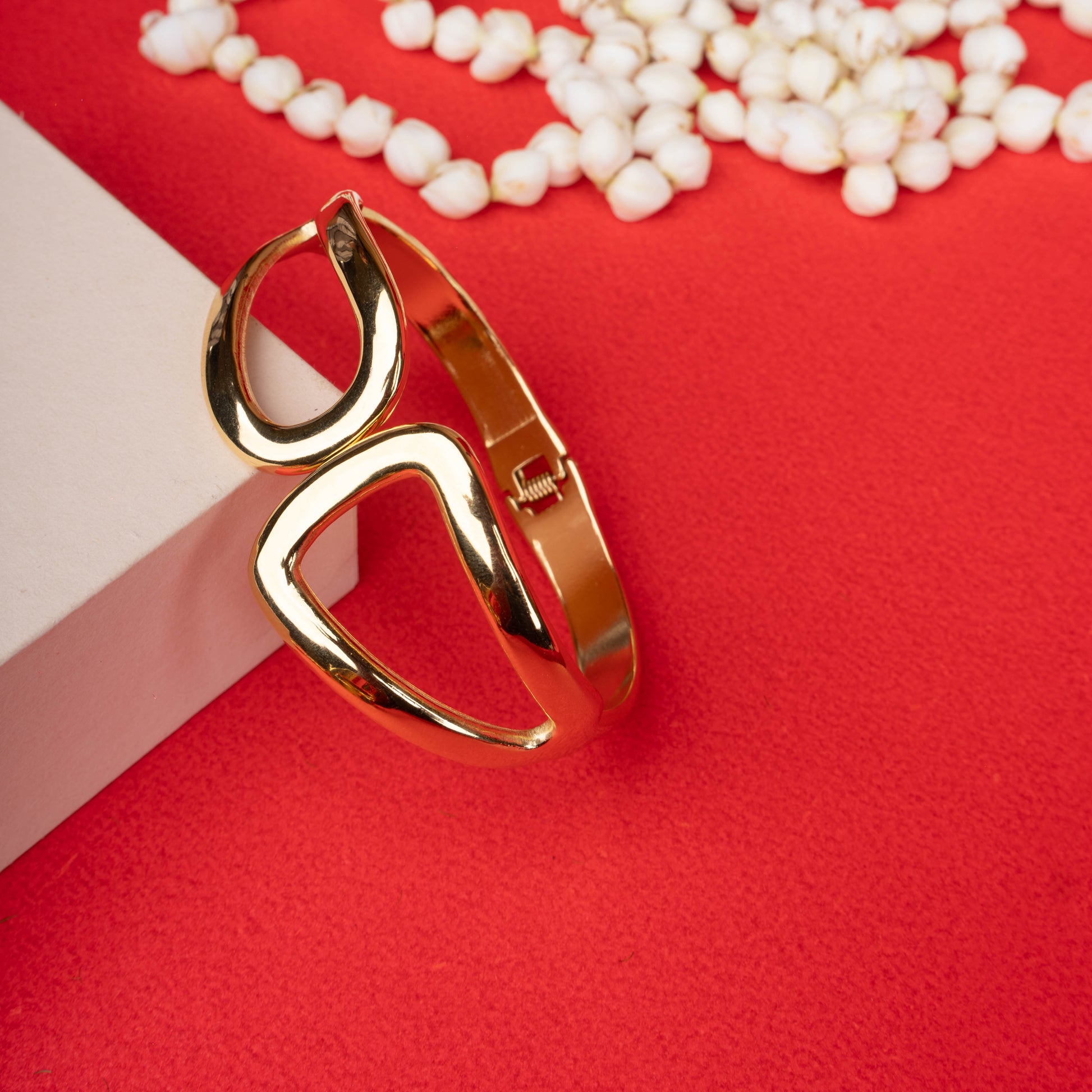 Gold abstract open shape bracelet with asymmetric cut-out design - Revaaj