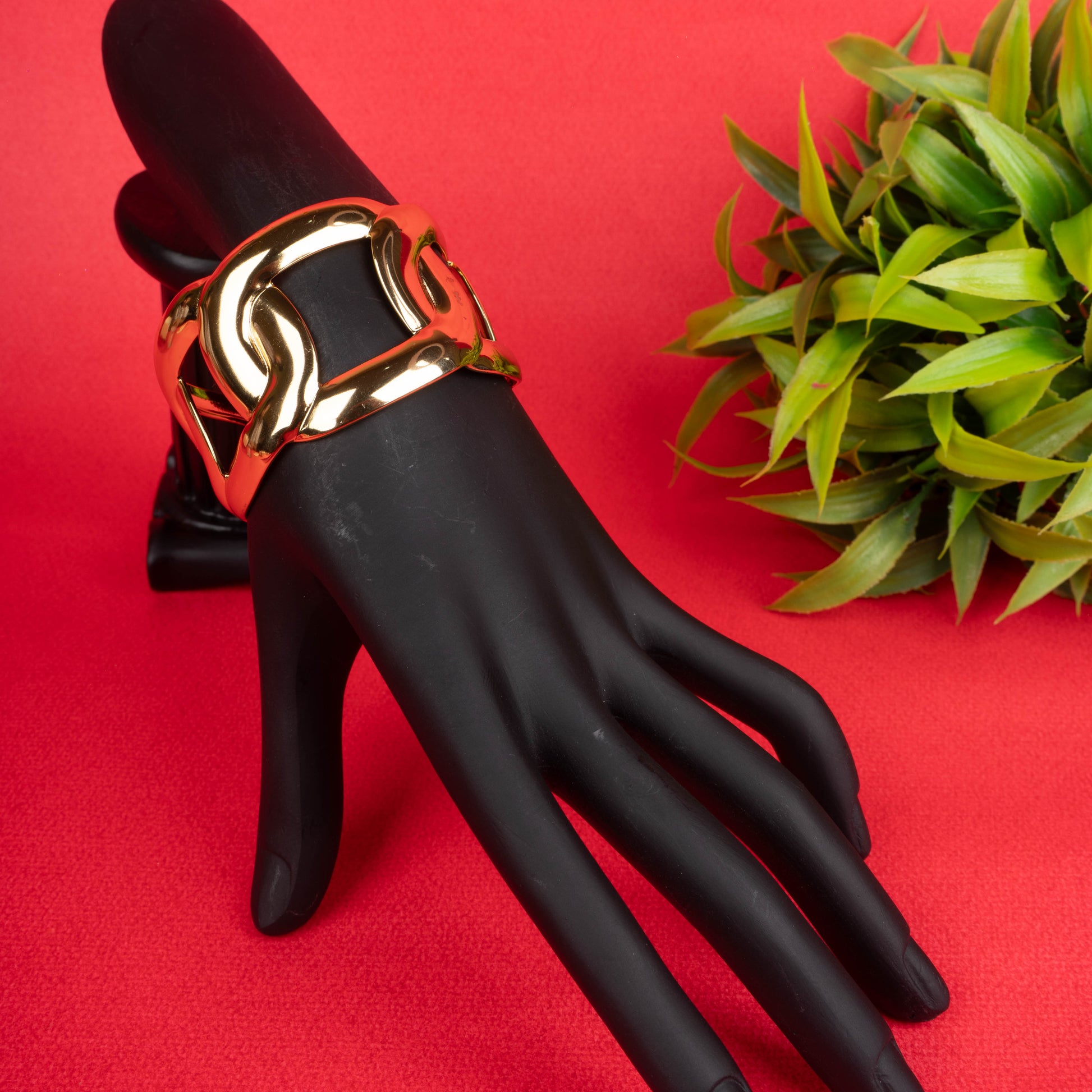 Wide gold-tone open cuff bracelet with a chunky chain link design - Revaaj