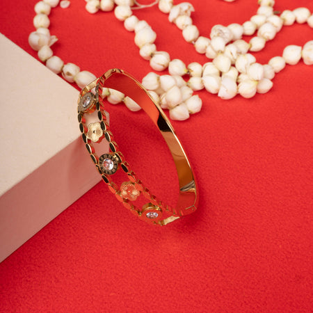 Gold-tone bracelet with roman numeral and flower motifs, accented by crystals - Revaaj
