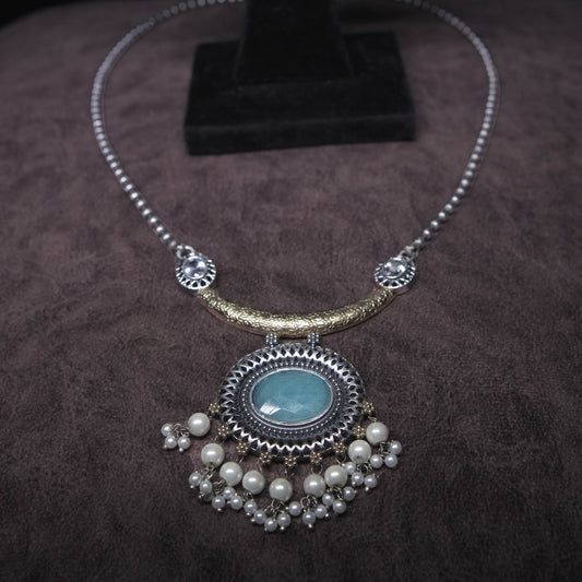Vintage oxidized silver necklace set with mint green stone pendant and pearl drops, paired with matching earrings