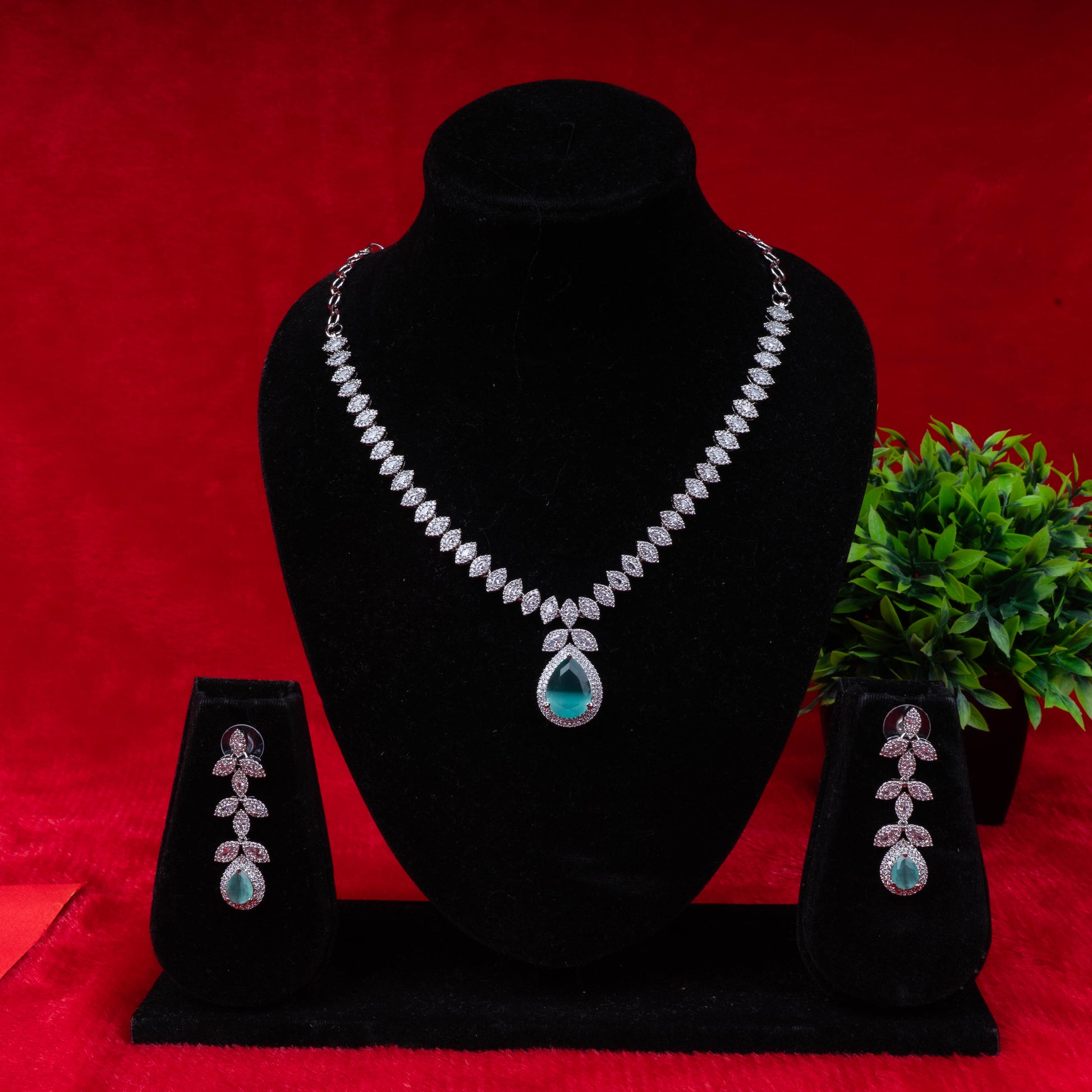 Emerald leaf elegance necklace set with green teardrop pendant and matching earrings - Revaaj