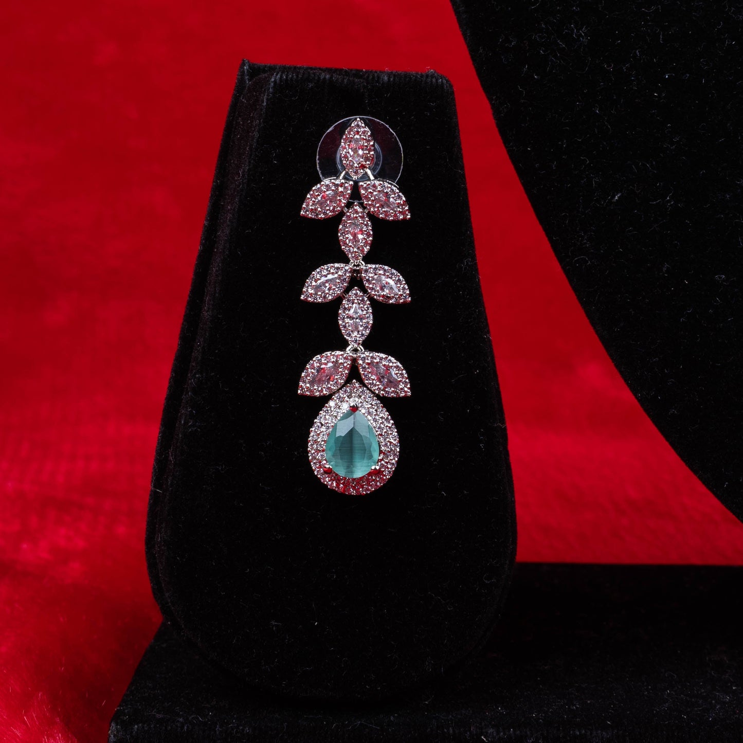 Emerald leaf elegance necklace set with green teardrop pendant and matching earrings third view - Revaaj