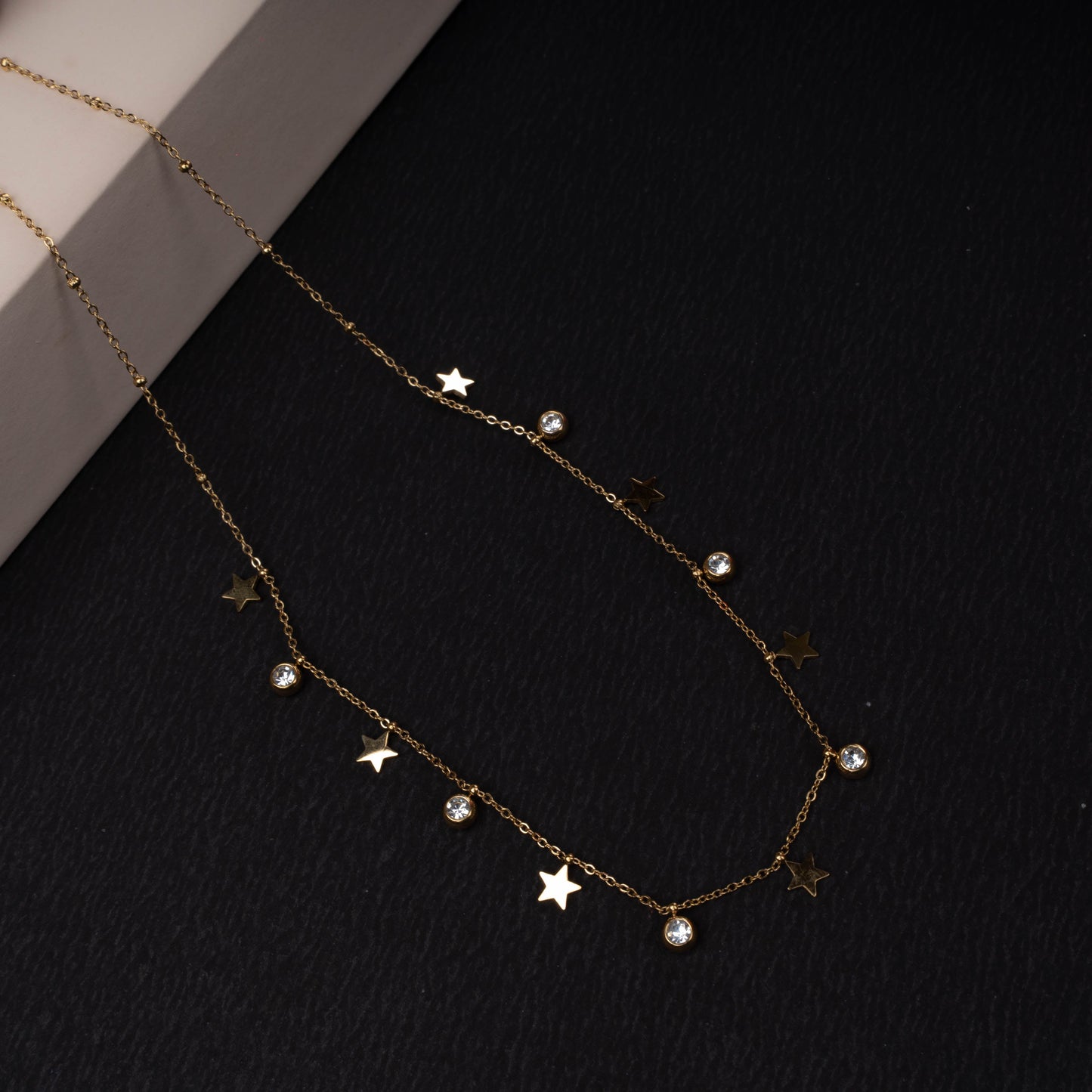 Gold-tone star charm necklace with crystal drops second view - Revaaj