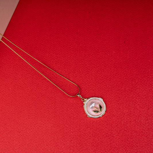Gold chain necklace with round pink mother-of-pearl pendant featuring gold leaf design - Revaaj