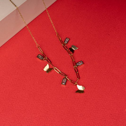 Gold link chain necklace with butterfly charms and rectangular gemstone accents - Revaaj