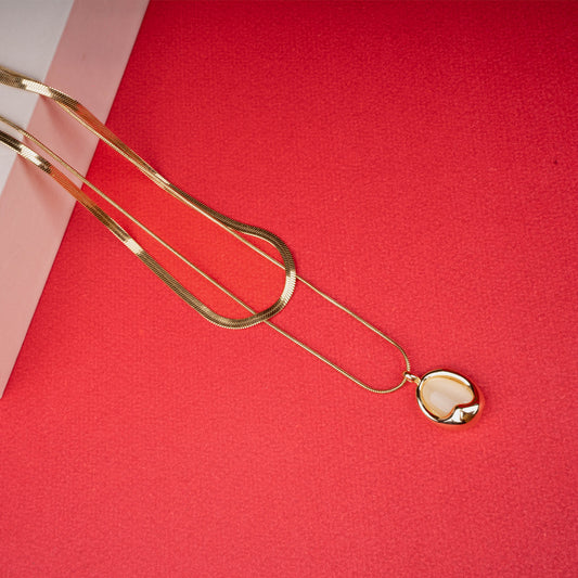 Gold double-layer necklace with snake chain and beige enamel heart pendant - Revaaj