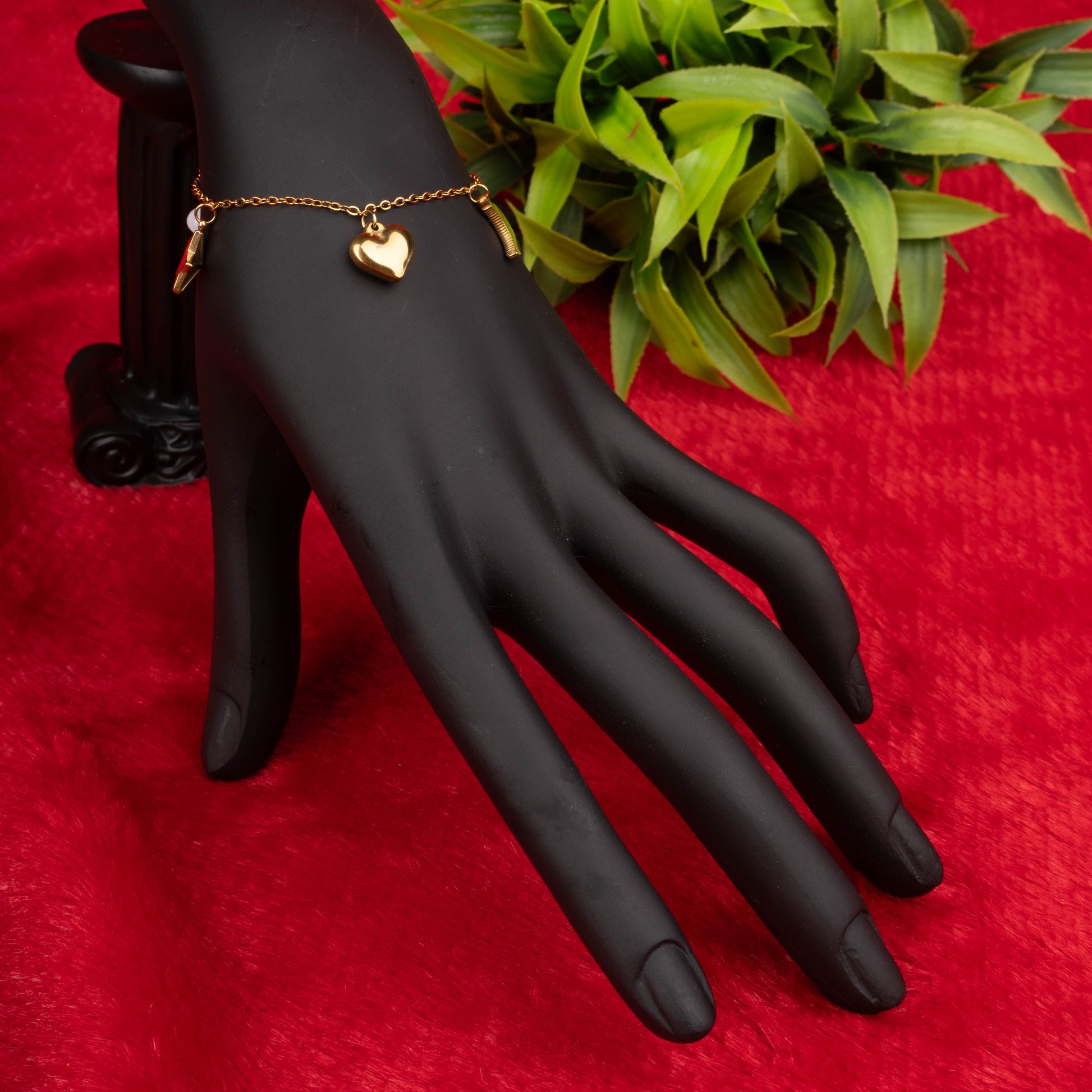 Gold charm bracelet with moon, star, heart, and pearl-like charms – Revaaj