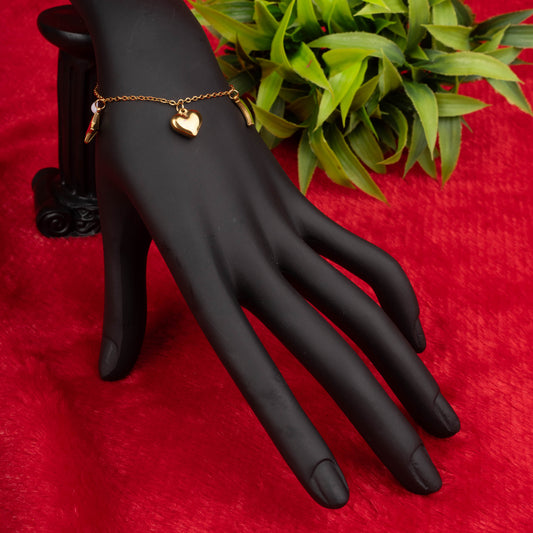 Gold charm bracelet with moon, star, heart, and pearl-like charms – Revaaj