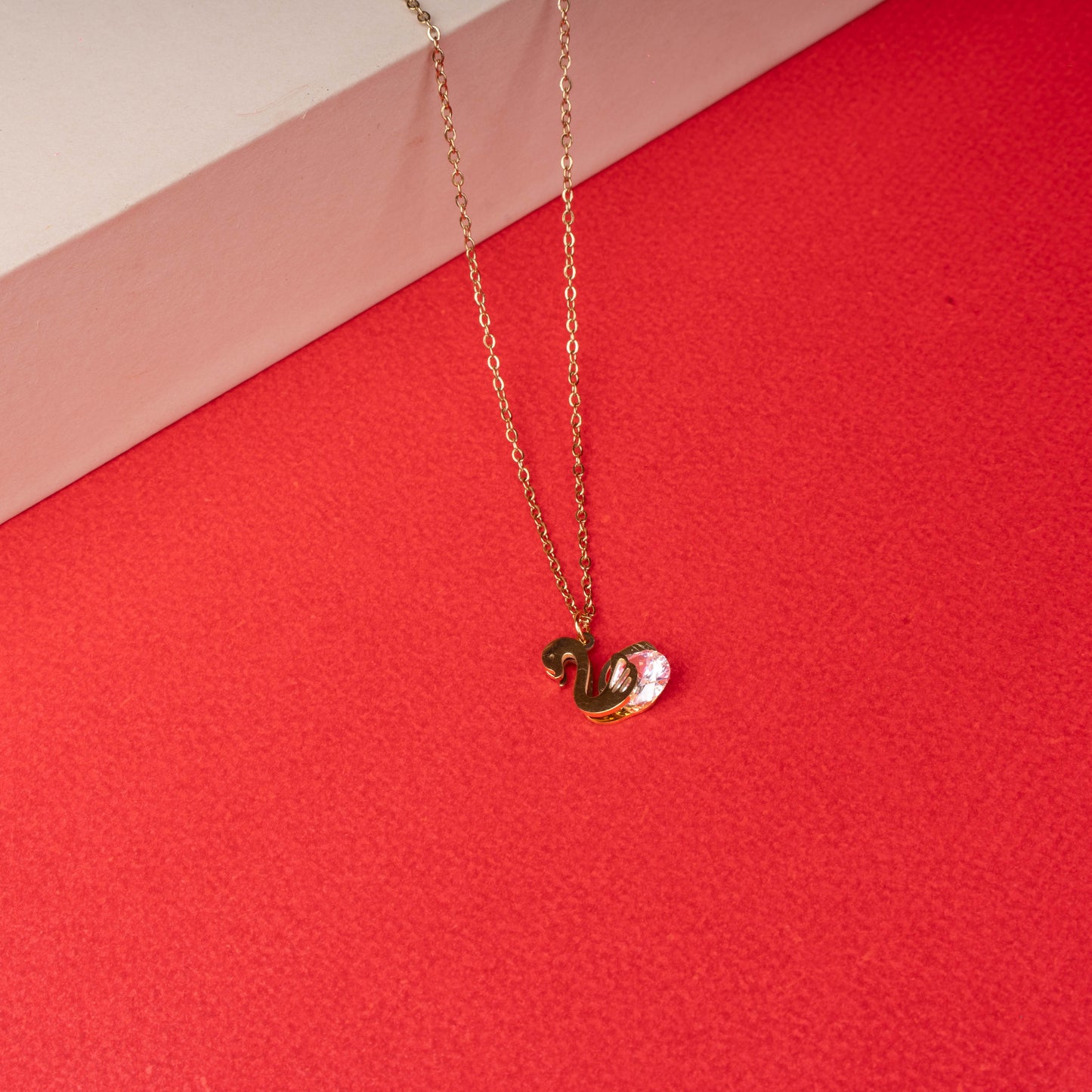Gold swan pendant necklace with crystal accent floored image - Revaaj