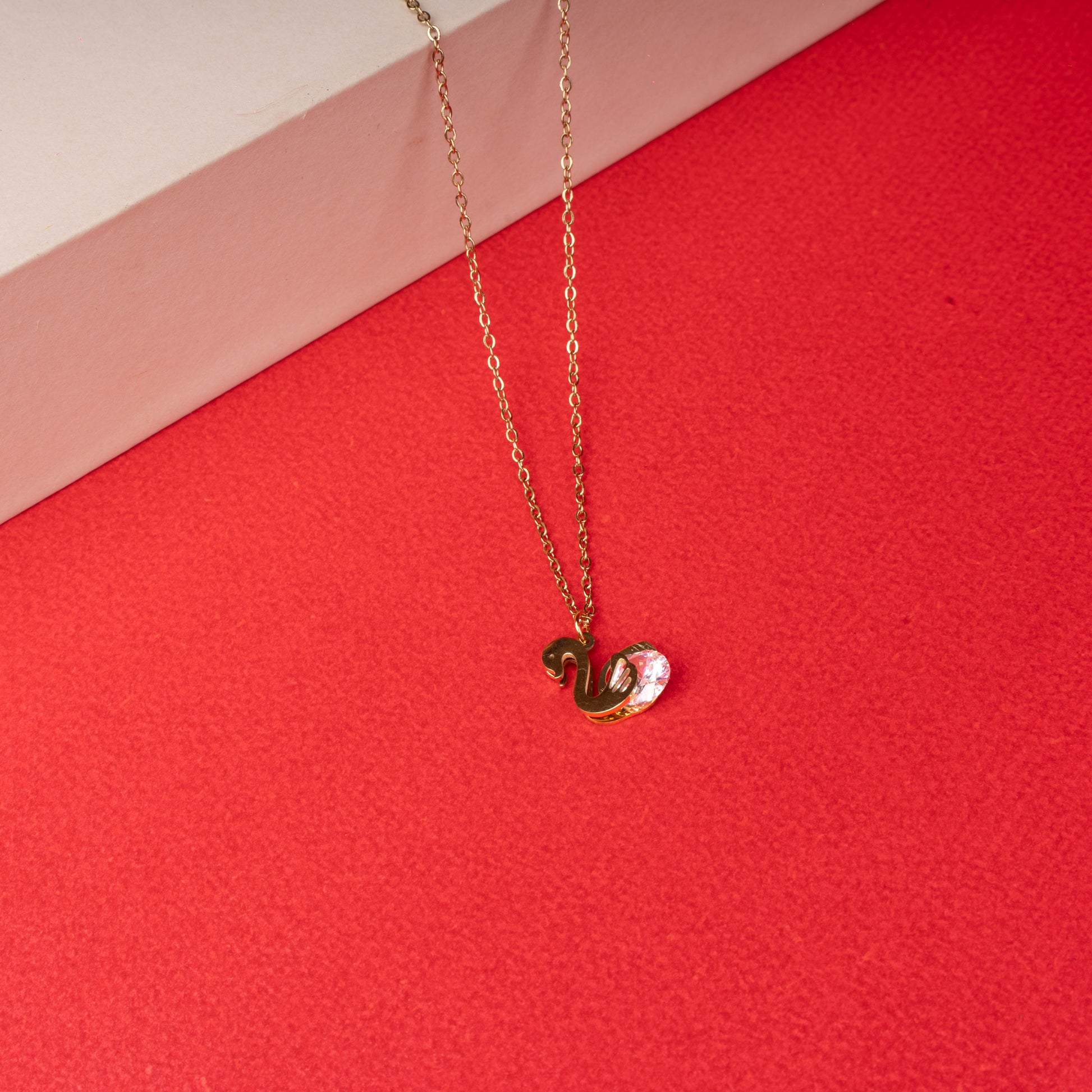 Gold swan pendant necklace with crystal accent floored image - Revaaj