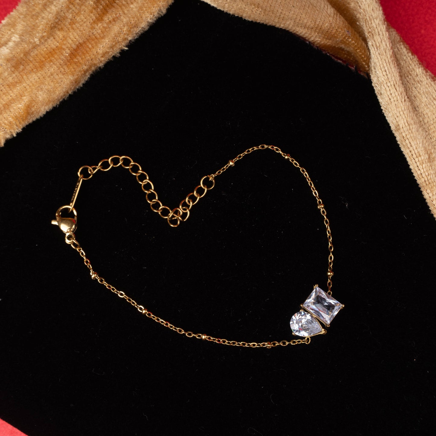 Gold double heart charm bracelet with polished gold-tone chain zoomed image - Revaaj