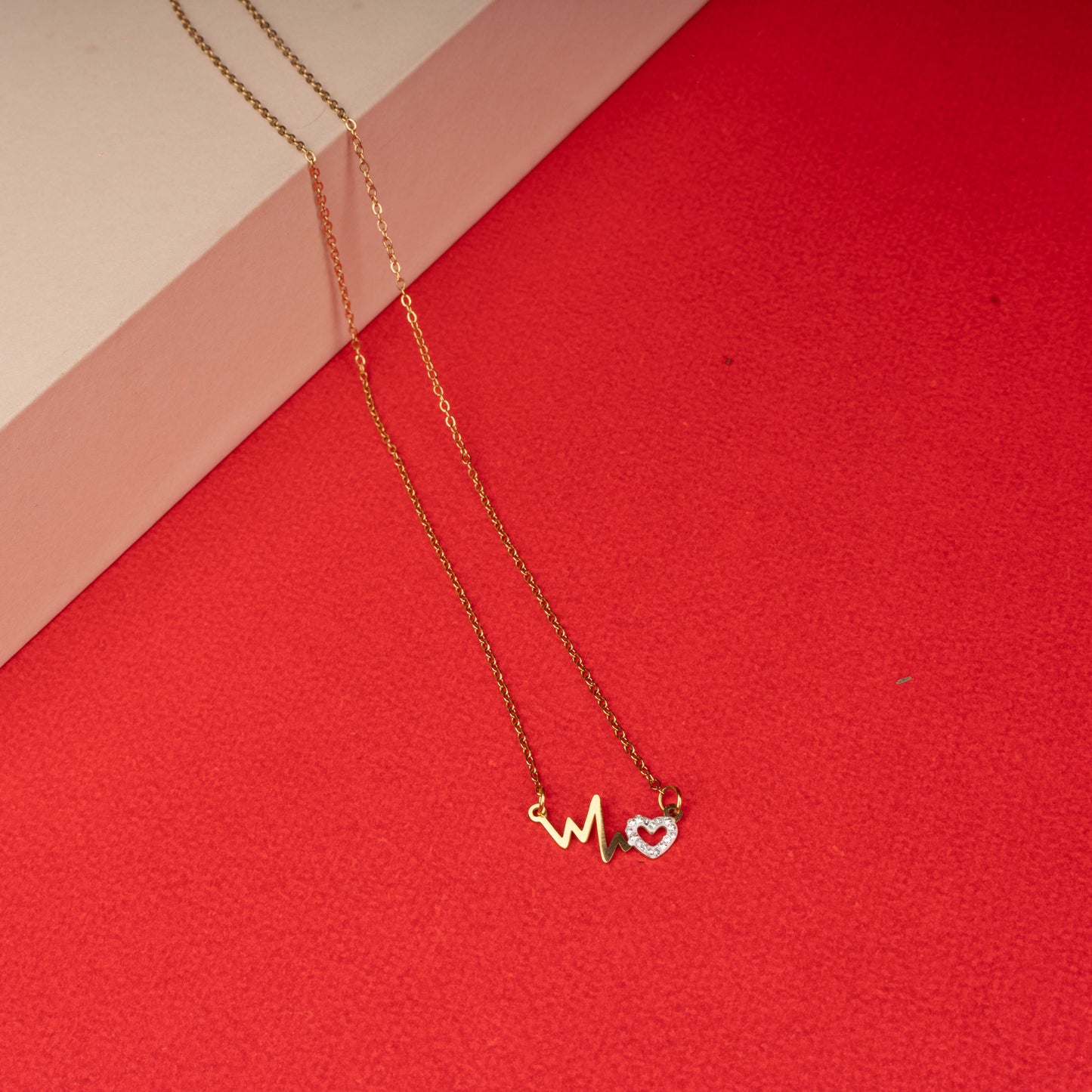 Gold necklace with heartbeat motif and crystal-studded heart pendant - Revaaj