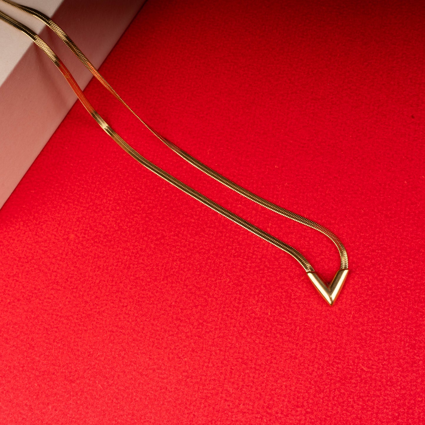Gold chevron snake chain necklace with V-shaped pendant - Revaaj