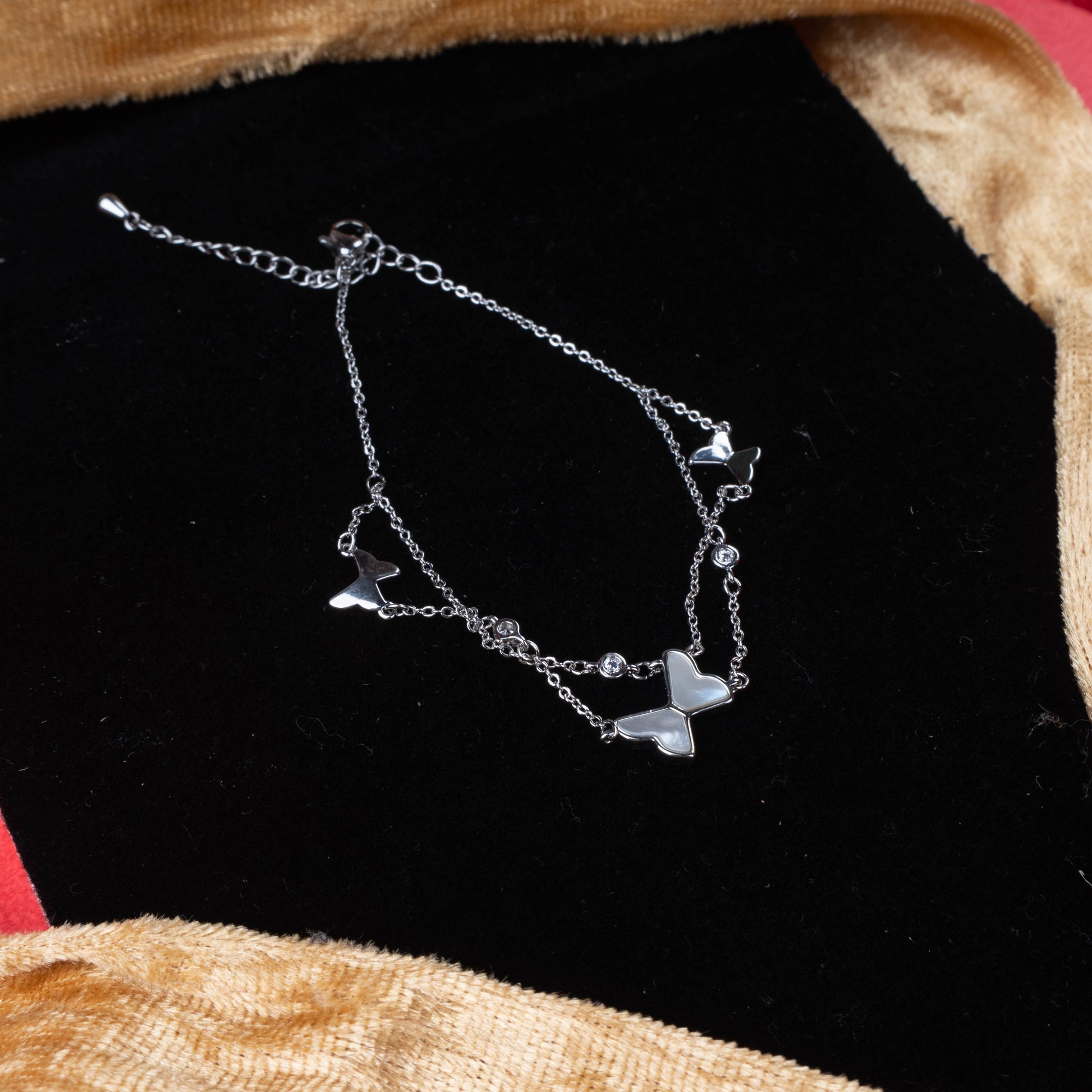 Silver color dual layer bracelet with butterfly charms and crystal accents second view- Revaaj