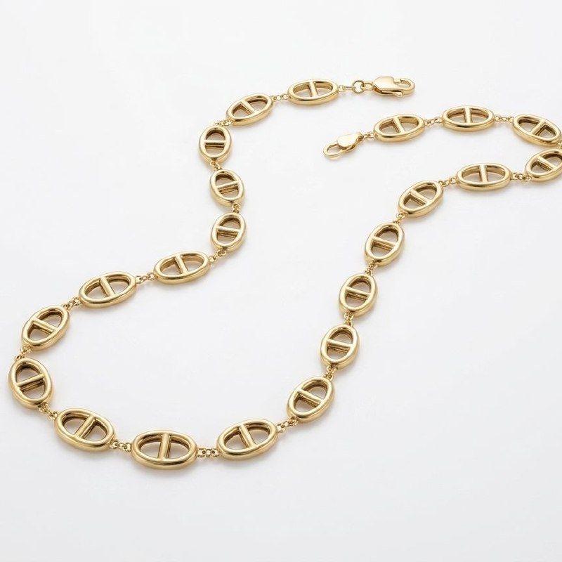 Premium gold oval link necklace with central bar design laid flat on white background showing full chain and clasp 1