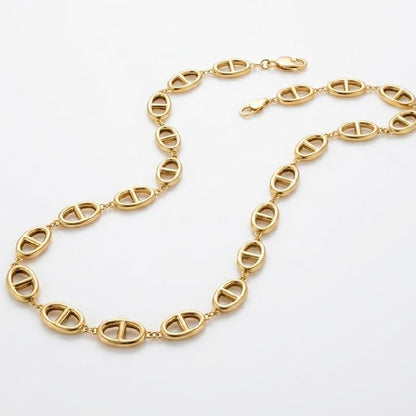 Premium gold oval link necklace with central bar design laid flat on white background showing full chain and clasp 1