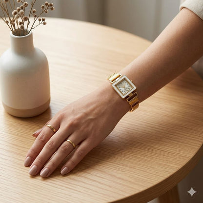 Premium gold square face women's watch with white dial, gold hands, and geometric gold metal link band on white background 2