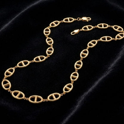 Premium gold oval link necklace with central bar design laid flat on white background showing full chain and clasp 3