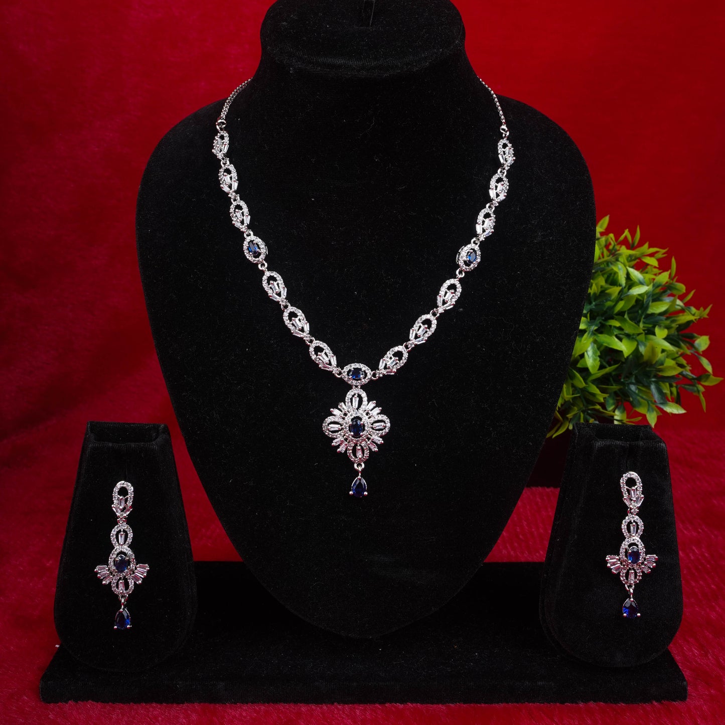 Fashion jewelry set with silver-tone finish and blue stones, including necklace and earrings - Revaaj