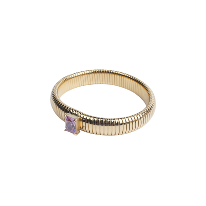 Gold-tone ribbed bangle bracelet with a single square-cut pink crystal white background - Revaaj