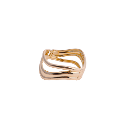 Gold-tone open cuff bracelet with a triple wave design, worn on a black mannequin hand white image - Revaaj