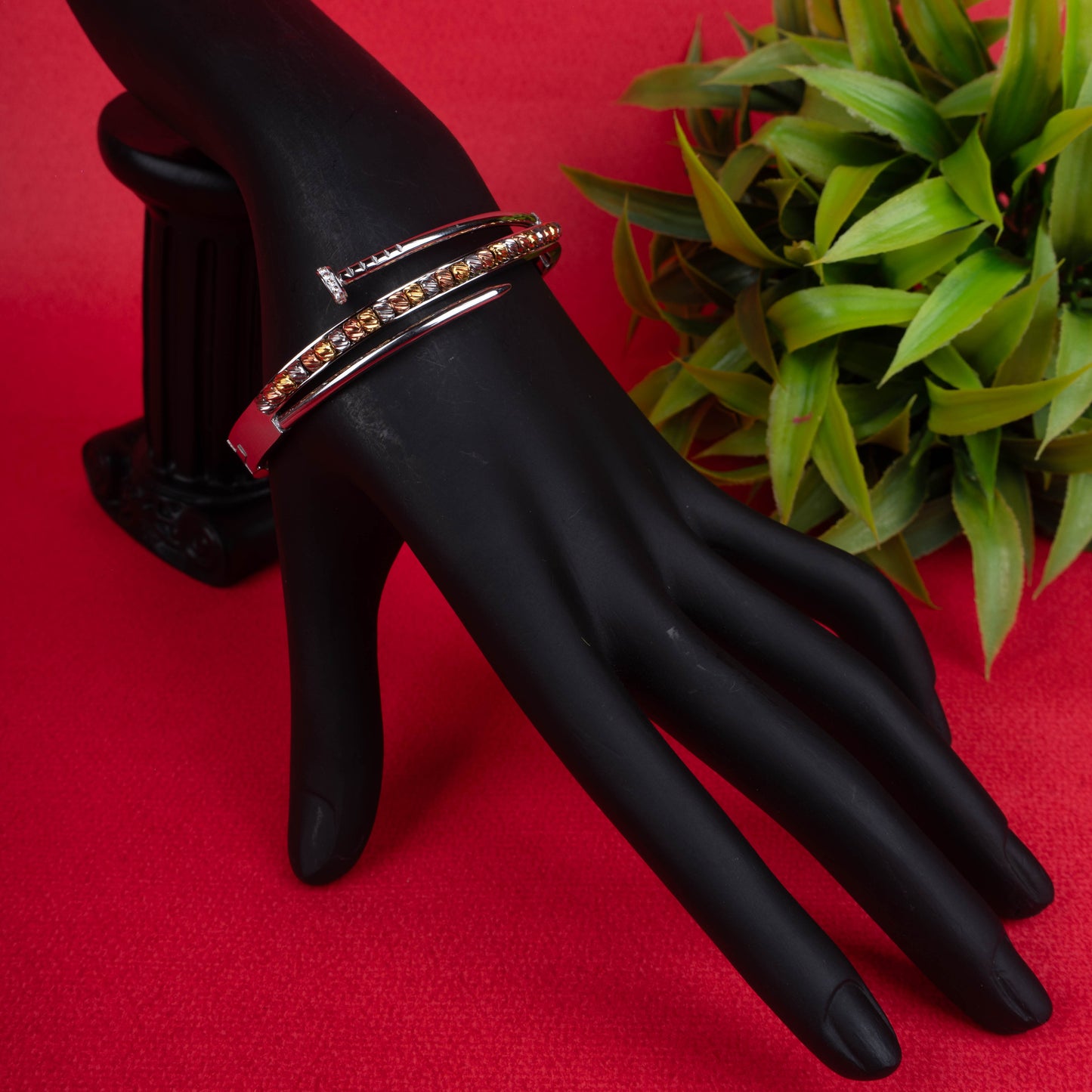 Silver-tone hinged bracelet with a curved nail design and a second band featuring multi-colored textured beads - Revaaj