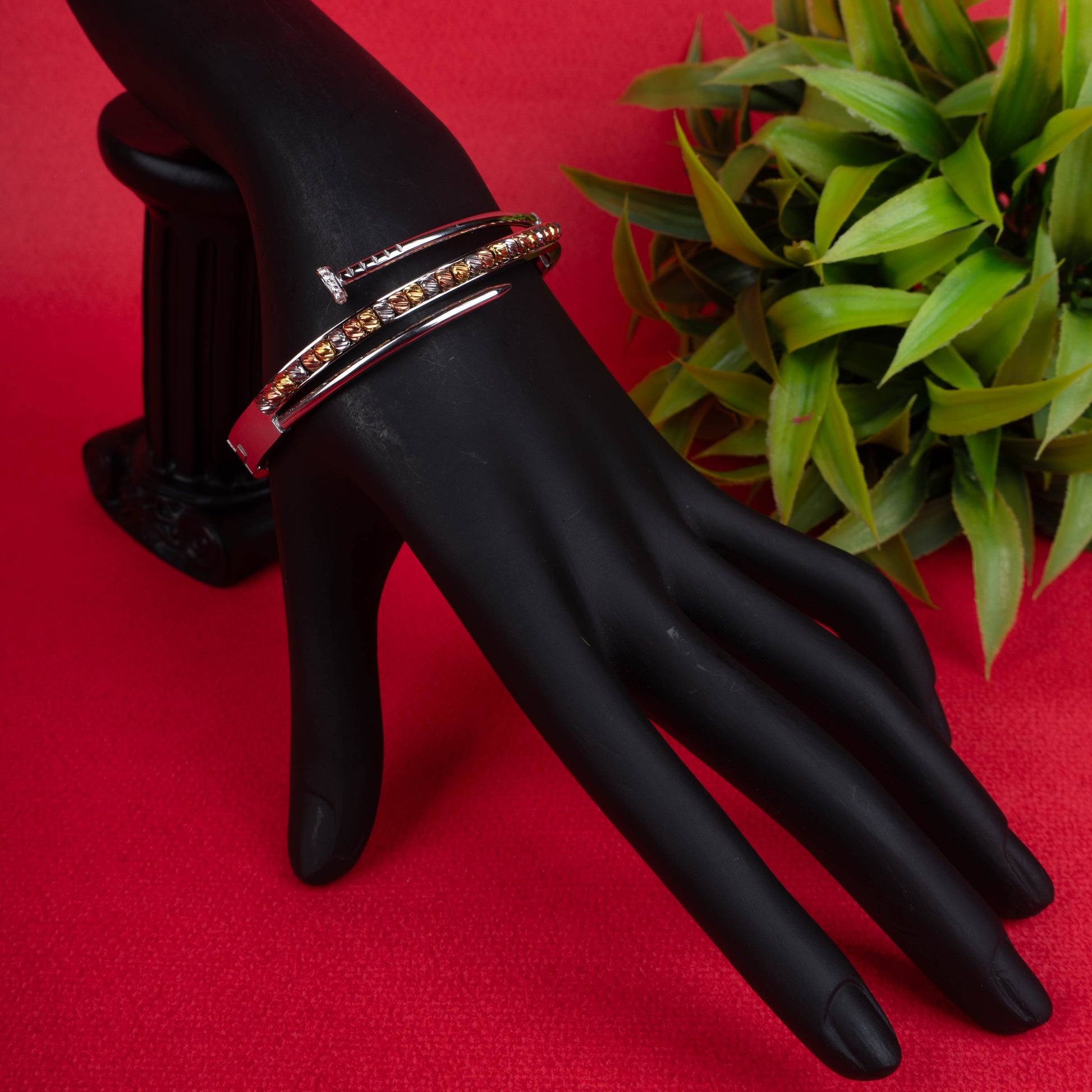 Silver-tone hinged bracelet with a curved nail design and a second band featuring multi-colored textured beads - Revaaj