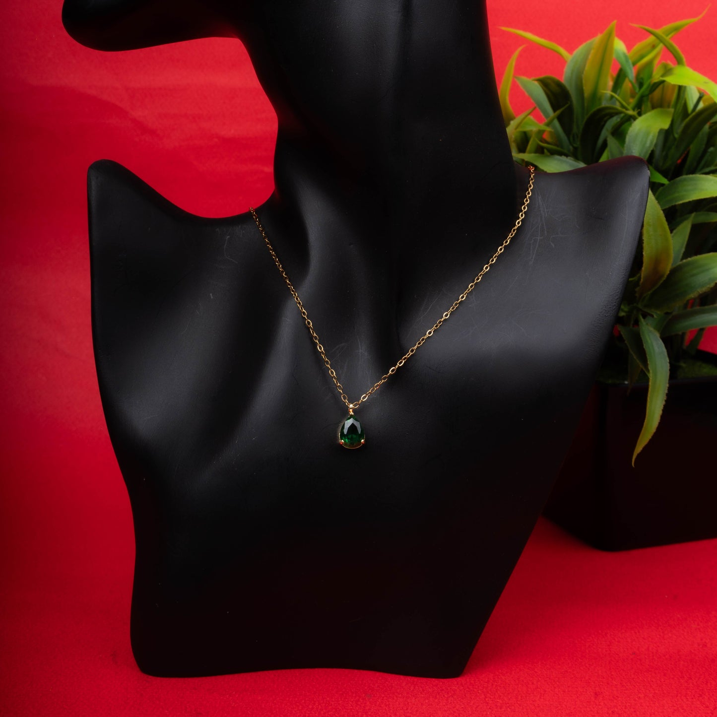 Emerald teardrop pendant necklace with matching green stone stud earrings - Revaaj