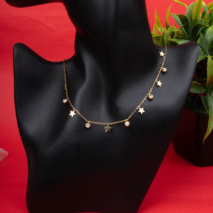Gold-tone star charm necklace with crystal drops - Revaaj