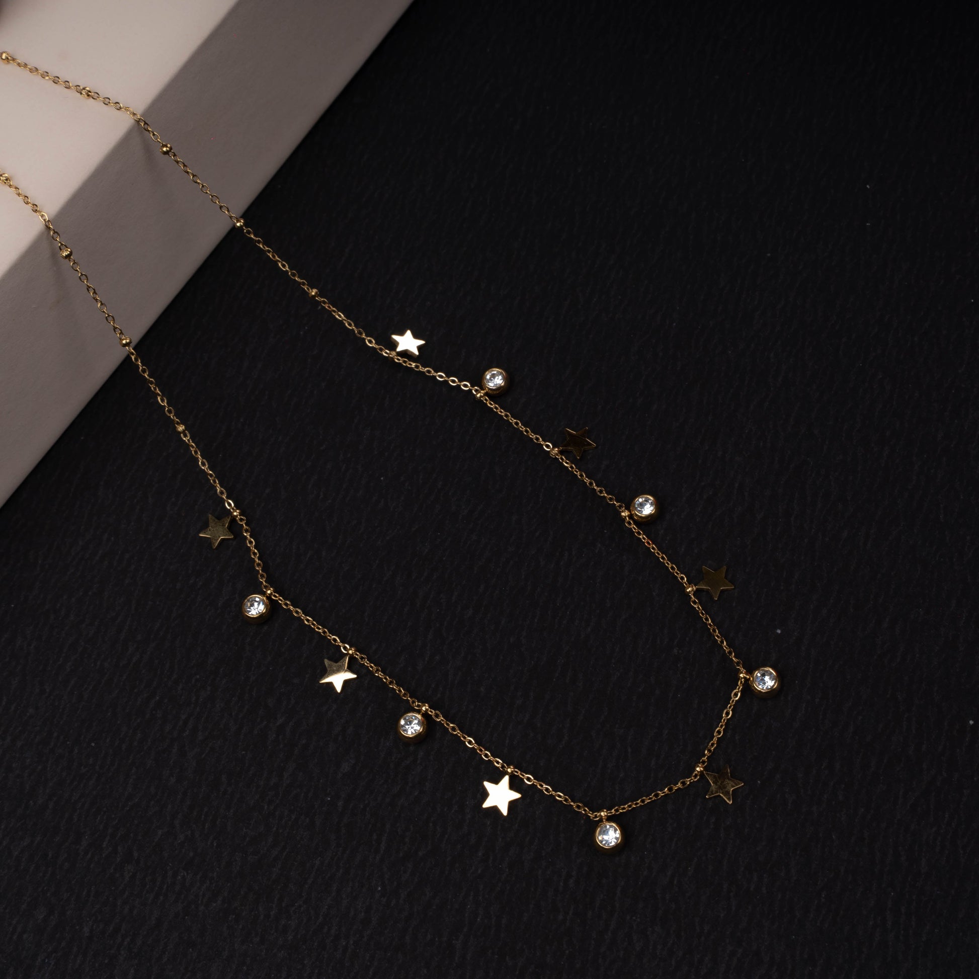 Gold-tone star charm necklace with crystal drops second view - Revaaj