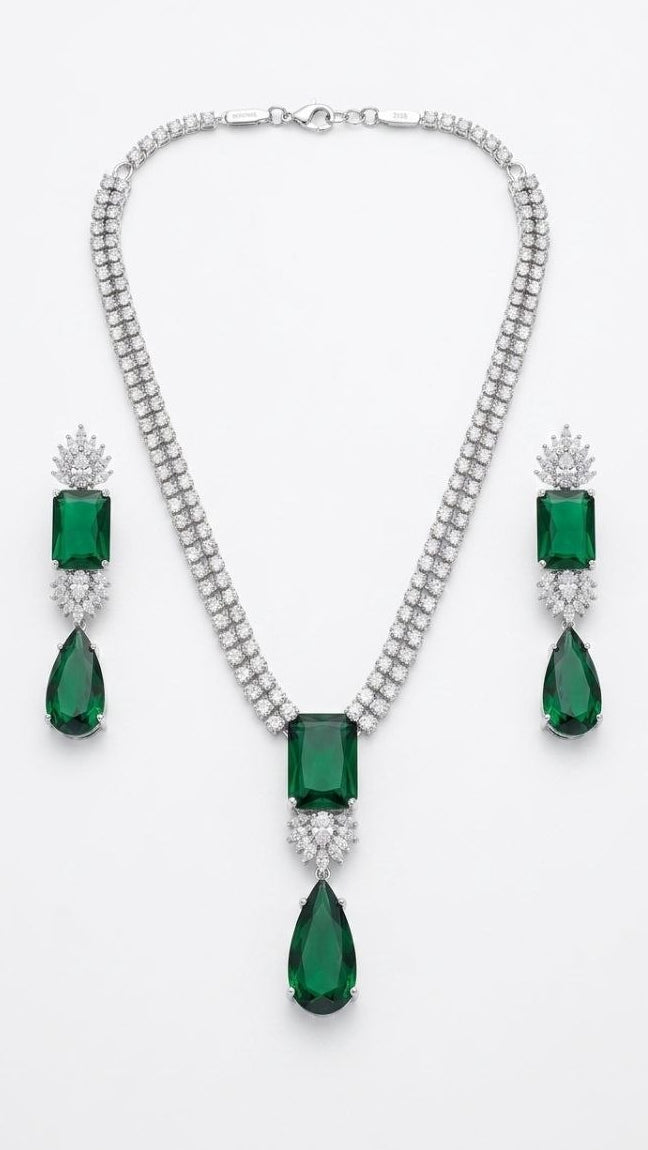 Premium emerald green rectangular and teardrop diamond necklace with matching drop earrings set in silver 1