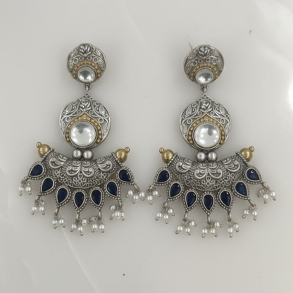 Oxidized Silver Peacock Jhumka Earrings with Green Stones and Dual Bird Design ground