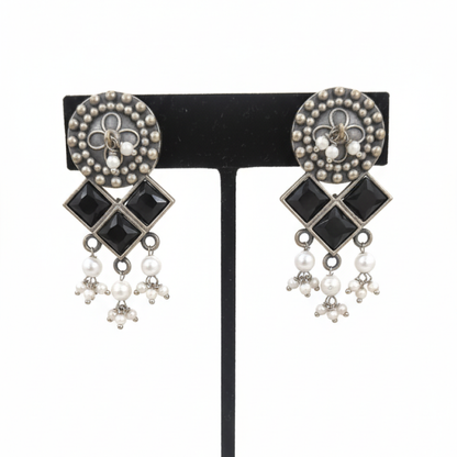 Oxidized Silver Black Stone Drop Earrings with Pearl Beads and Geometric Design ground