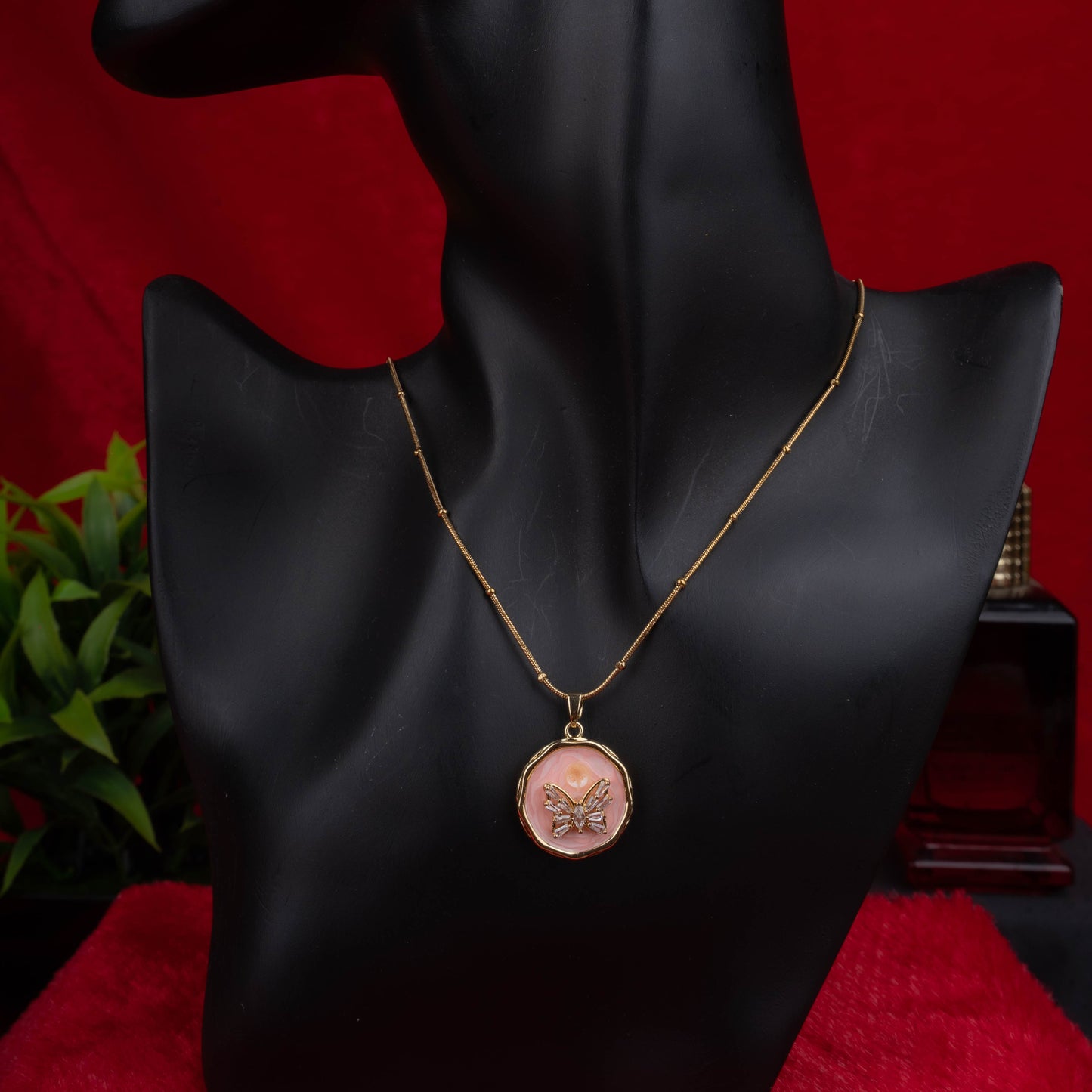 Gold chain necklace with round pink enamel butterfly pendant - Revaaj