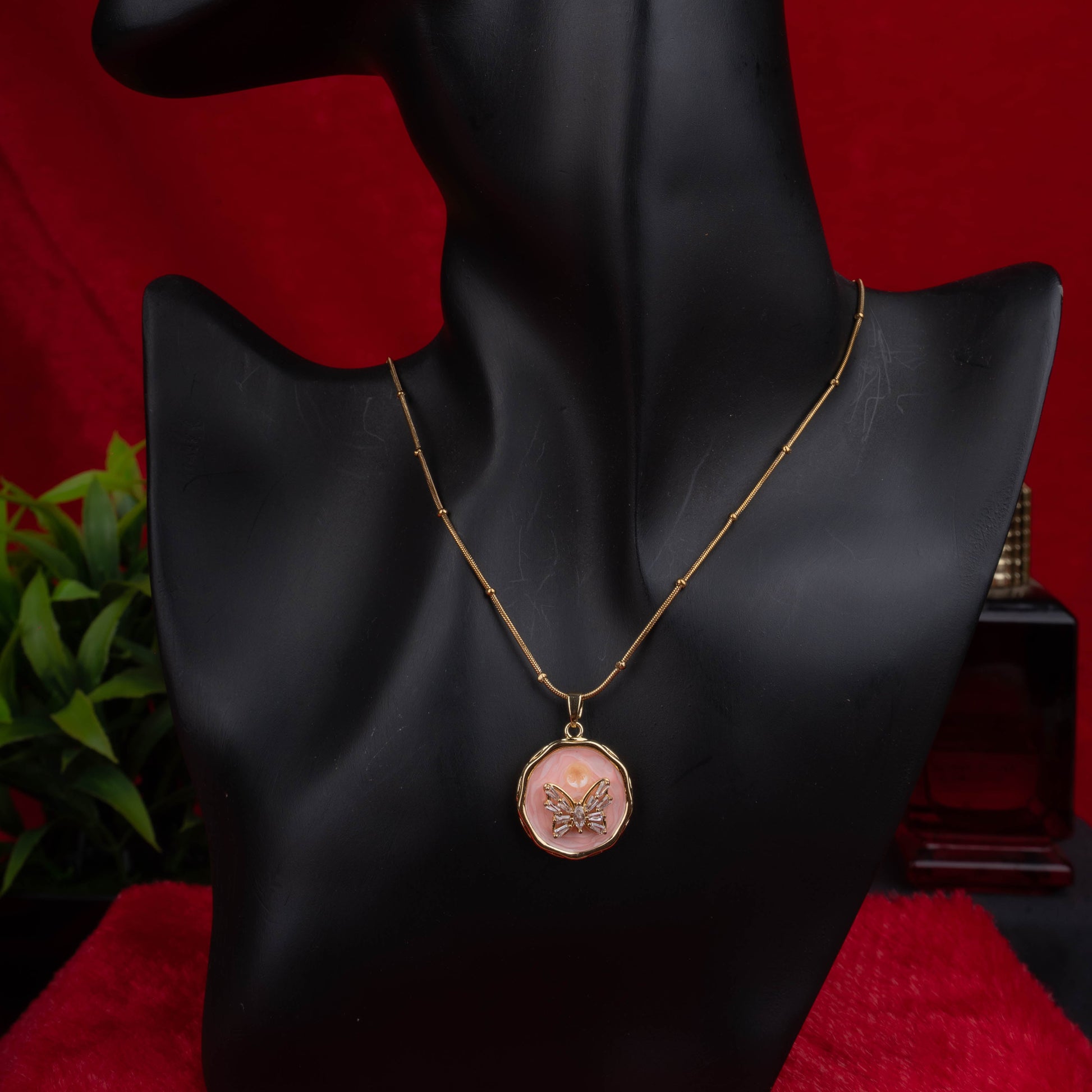 Gold chain necklace with round pink enamel butterfly pendant - Revaaj