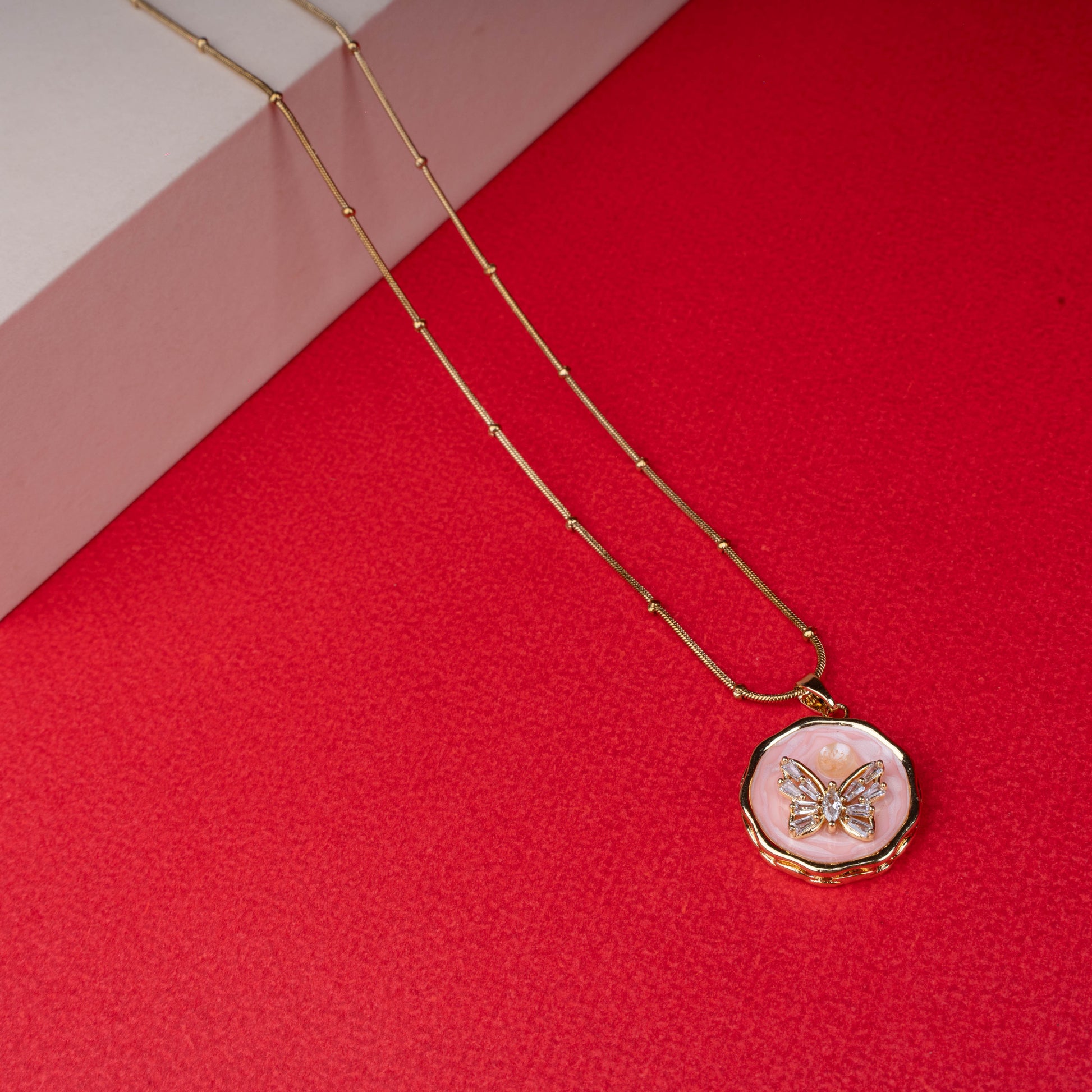 Gold chain necklace with round pink enamel butterfly pendant another view - Revaaj