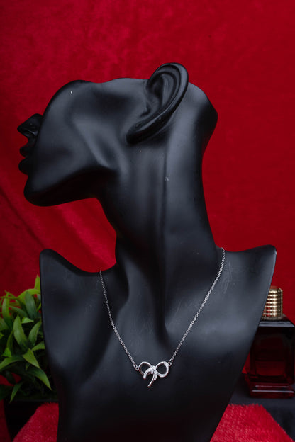 Silver bow pendant necklace with sparkling stone detailing - Revaaj