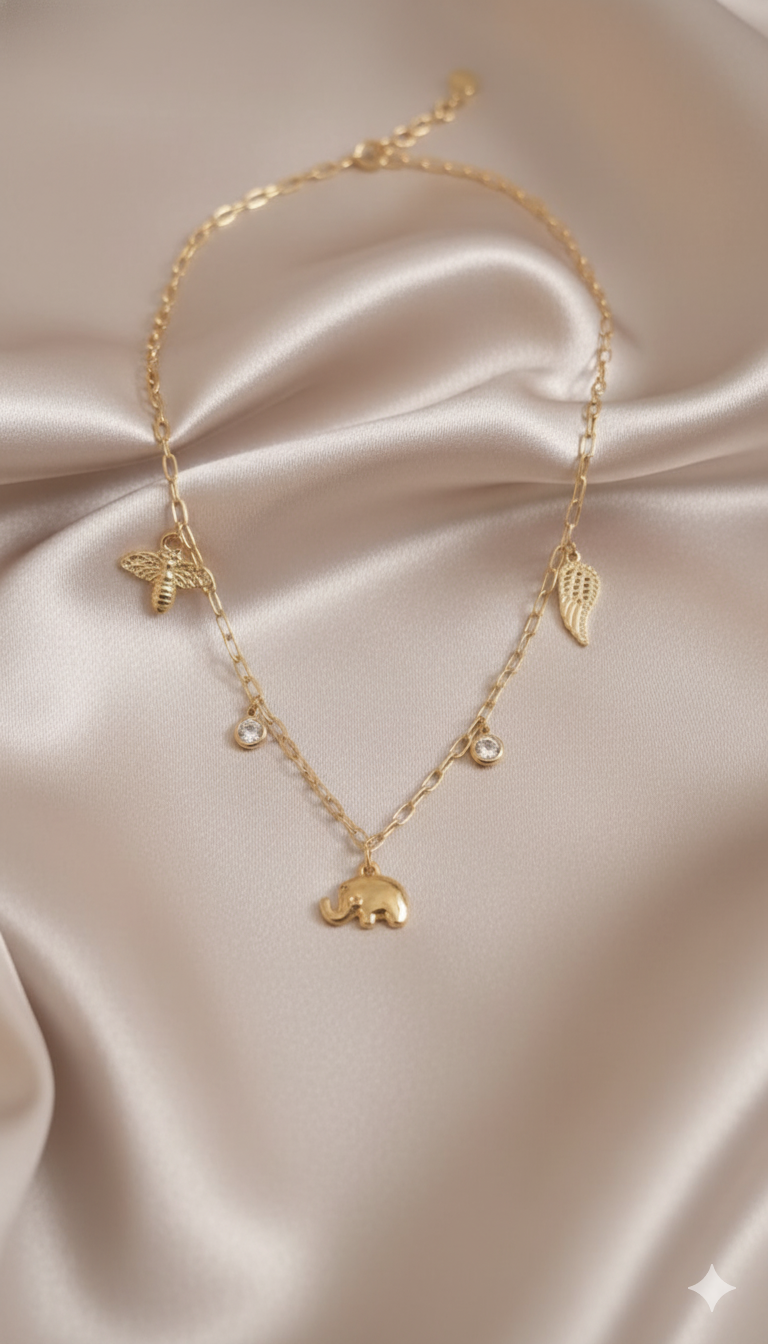 Gold-Plated Elephant Charm Necklace with Wing and Bee Pendants and Stone Accents