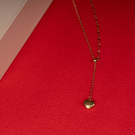Gold heart drop necklace with minimalist pendant floored image - Revaaj