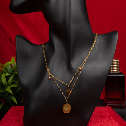 Gold layered necklace with star and compass pendants - Revaaj