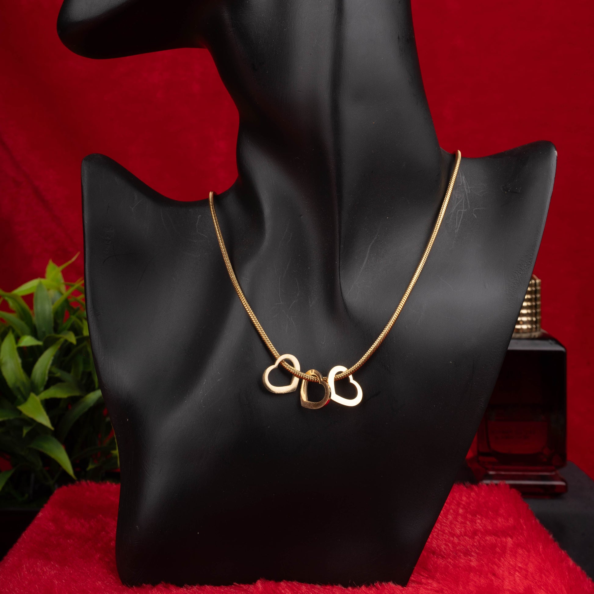 Gold double heart pendant necklace with interlinked open heart charms - Revaaj