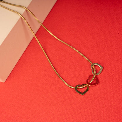 Gold double heart pendant necklace with interlinked open heart charms second view - Revaaj