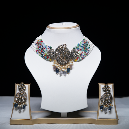 Revaaj Kundan multicolor beaded necklace set with matching earrings displayed on a white mannequin.